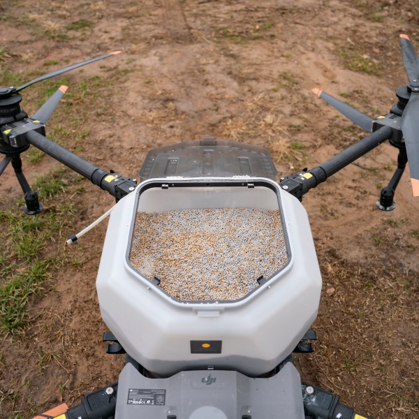 Russell Hedrick uses a DJI drone to put crop cover on his farm, Tuesday, Dec. 17, 2024, in Hickory, N.C. (AP Photo/Allison Joyce)