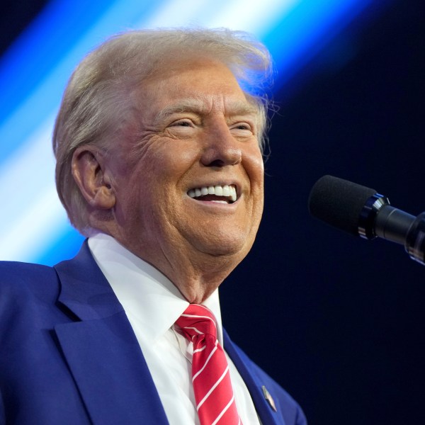 President-elect Donald Trump speaks at AmericaFest, Sunday, Dec. 22, 2024, in Phoenix. (AP Photo/Rick Scuteri)