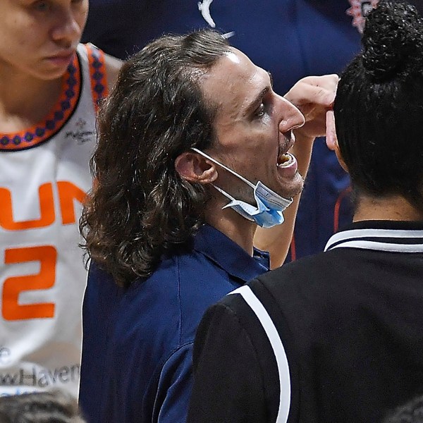 Connecticut Sun's Chris Koclanes talk with players during a timeout in the team's WNBA basketball game against the Washington Mystics on Friday, May 28, 2021, in Uncasville, Conn. (Sean D. Elliot/The Day via AP)