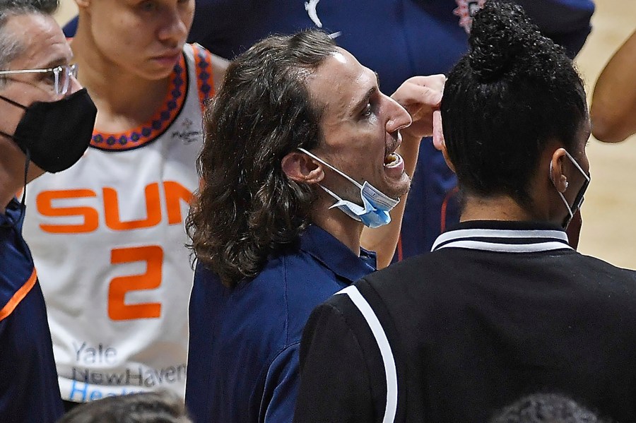 Connecticut Sun's Chris Koclanes talk with players during a timeout in the team's WNBA basketball game against the Washington Mystics on Friday, May 28, 2021, in Uncasville, Conn. (Sean D. Elliot/The Day via AP)