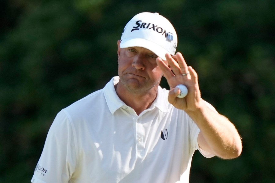 FILE - Lucas Glover waves after making a putt on the 13th hole during third round at the Masters golf tournament at Augusta National Golf Club Saturday, April 13, 2024, in Augusta, Ga. (AP Photo/Charlie Riedel, File)