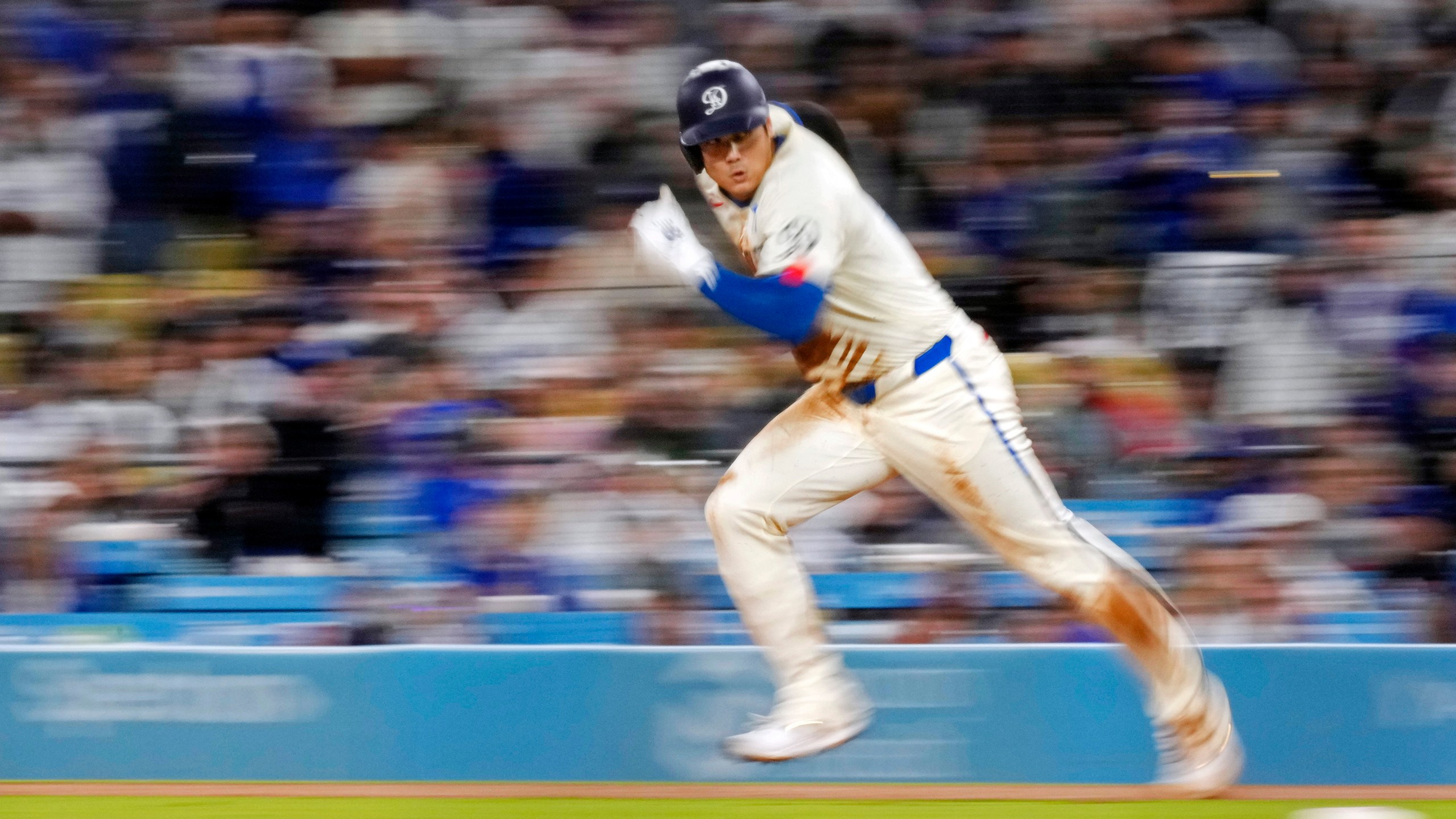 FILE - Los Angeles Dodgers' Shohei Ohtani runs from first on his way to stealing second during the ninth inning of a baseball game against the Colorado Rockies, Saturday, Sept. 21, 2024, in Los Angeles. (AP Photo/Mark J. Terrill, File)