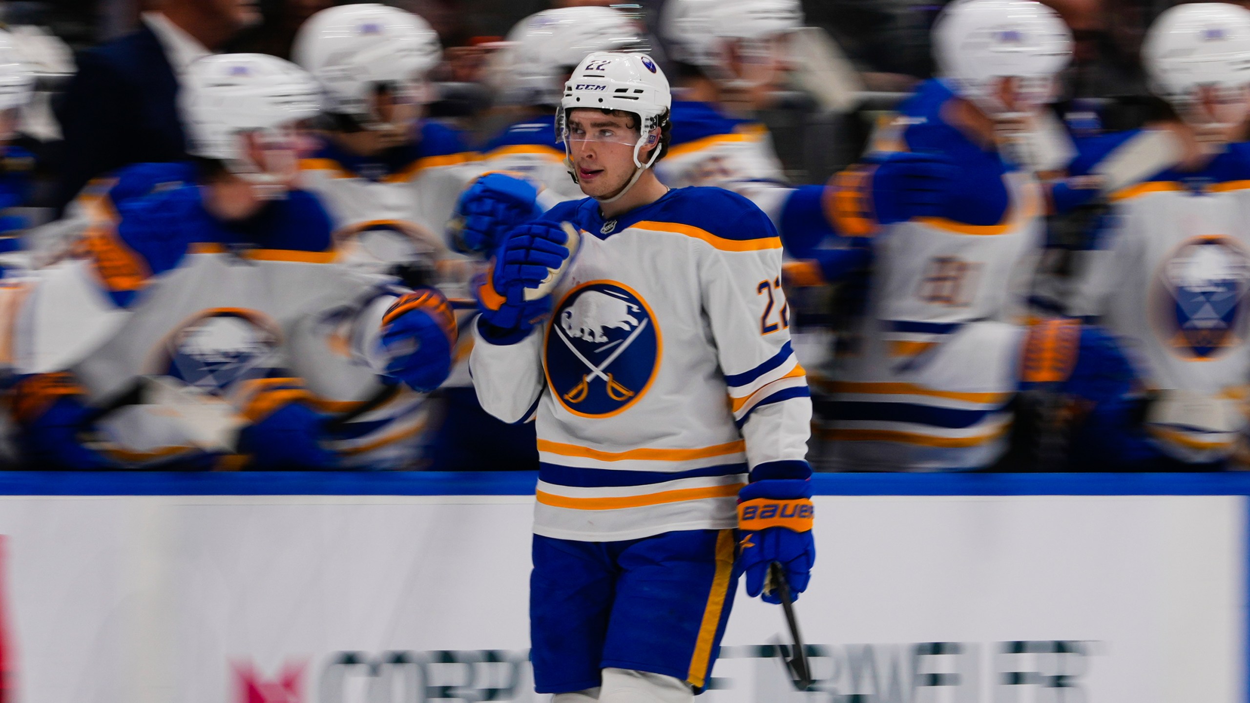 Buffalo Sabres' Jack Quinn (22) celebrates with teammates after scoring a goal during the second period of an NHL hockey game against the New York Islanders Monday, Dec. 23, 2024, in Elmont, N.Y. (AP Photo/Frank Franklin II)