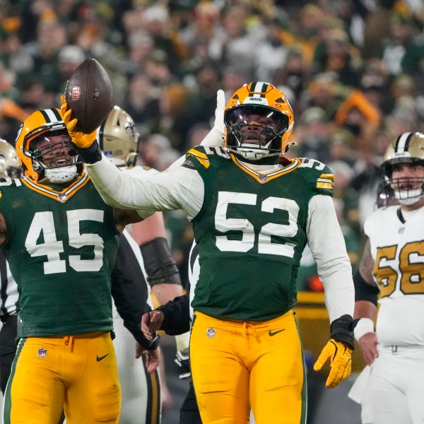 Green Bay Packers defensive end Rashan Gary (52) celebrates a fumble recovery during the first half of an NFL football game against the New Orleans Saints, Monday, Dec. 23, 2024, in Green Bay, Wis.(AP Photo/Morry Gash)