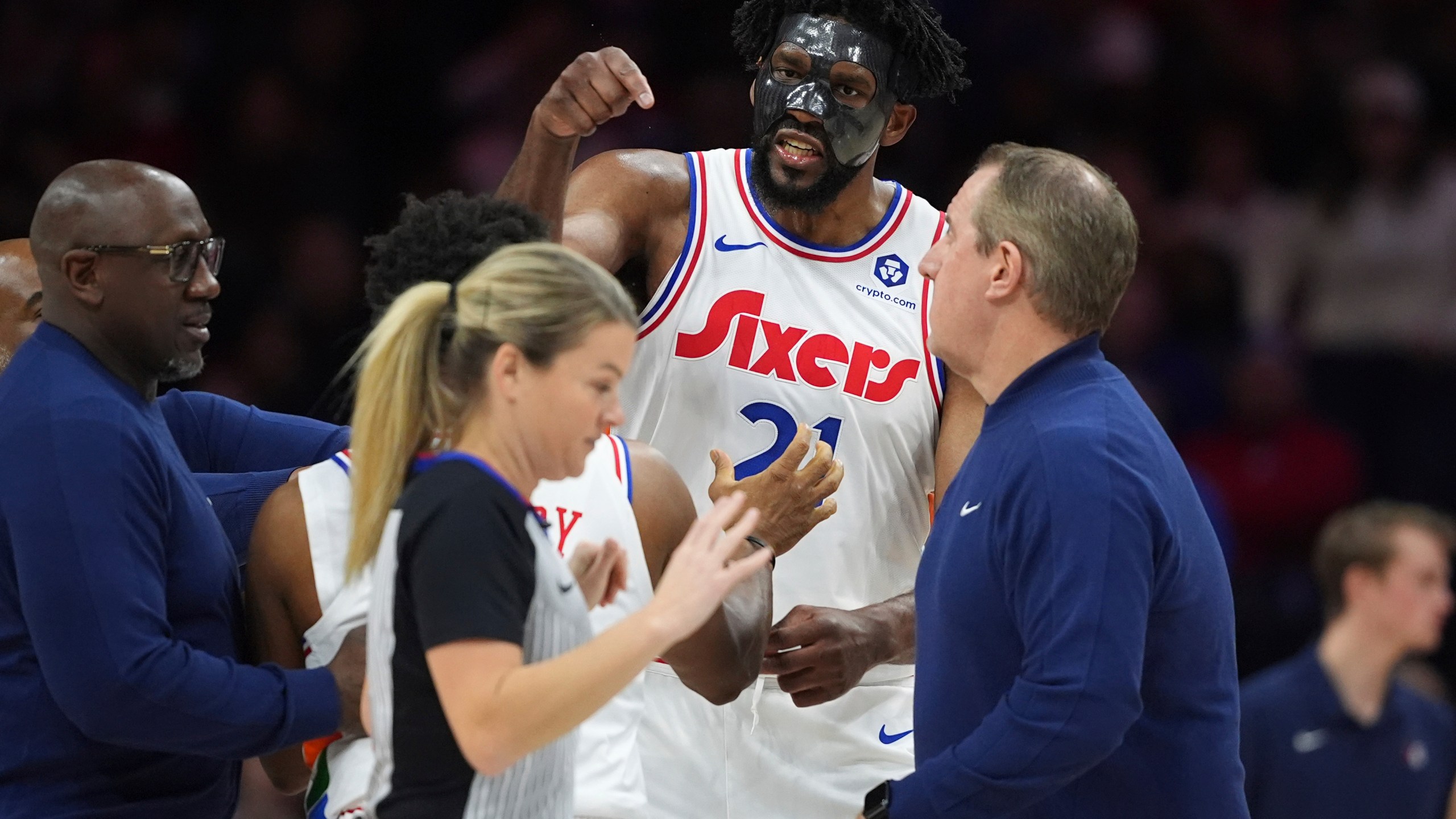 Philadelphia 76ers' Joel Embiid, right, argues with referee Jenna Schroeder during the first half of an NBA basketball game, Monday, Dec. 23, 2024, in Philadelphia. (AP Photo/Matt Slocum)