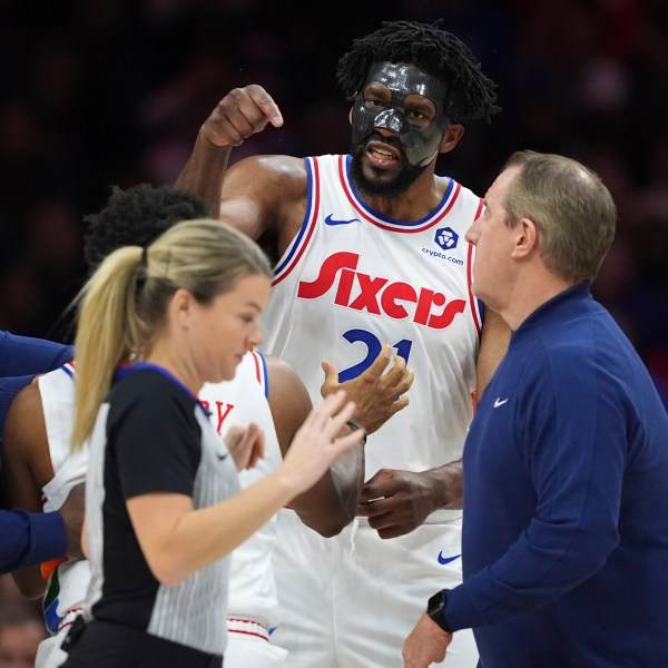 Philadelphia 76ers' Joel Embiid, right, argues with referee Jenna Schroeder during the first half of an NBA basketball game, Monday, Dec. 23, 2024, in Philadelphia. (AP Photo/Matt Slocum)