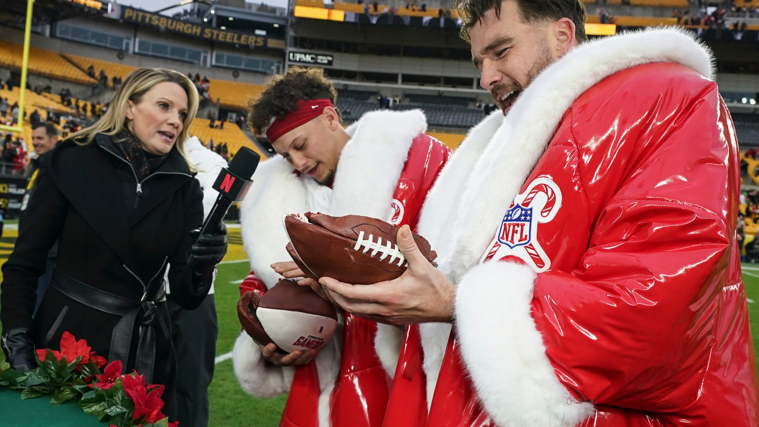 Kansas City Chiefs quarterback Patrick Mahomes and Travis Kelce speak after an NFL football game against the Pittsburgh Steelers, Wednesday, Dec. 25, 2024, in Pittsburgh. (AP Photo/Matt Freed)