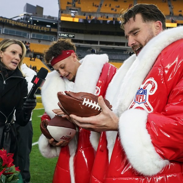 Kansas City Chiefs quarterback Patrick Mahomes and Travis Kelce speak after an NFL football game against the Pittsburgh Steelers, Wednesday, Dec. 25, 2024, in Pittsburgh. (AP Photo/Matt Freed)