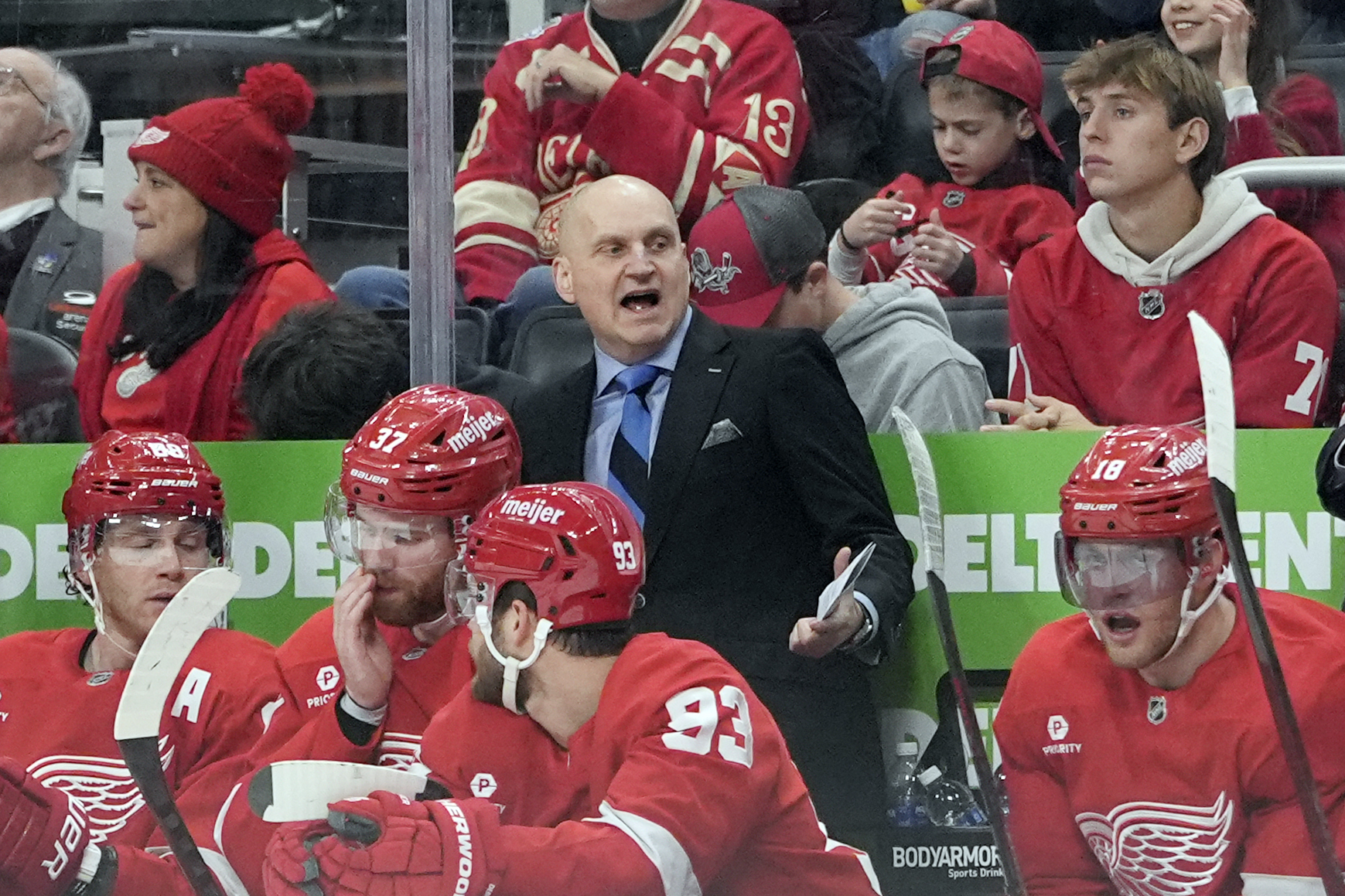 Detroit Red Wings head coach Derek Lalonde talks to his players during the second period of an NHL hockey game against the Montreal Canadiens, Friday, Dec. 20, 2024, in Detroit. (AP Photo/Carlos Osorio)