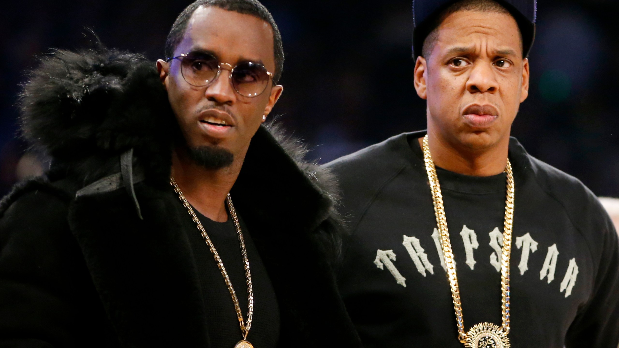 FILE - Rap moguls Sean "Diddy" Combs, left, and Jay-Z attend the NBA All-Star basketball game, Feb. 15, 2015, in New York. (AP Photo/Kathy Willens, File)