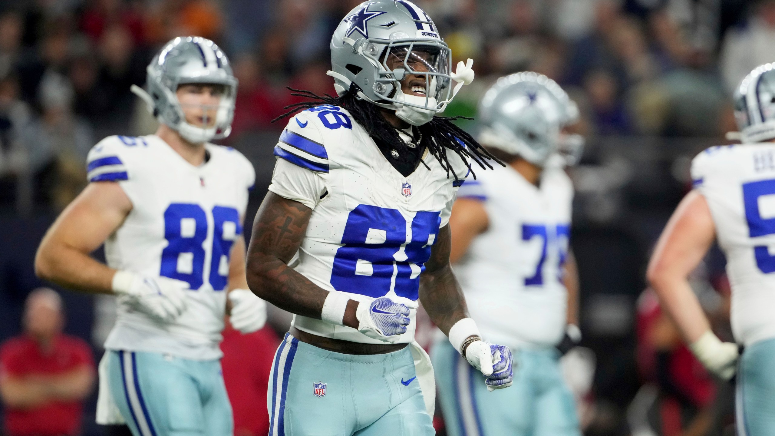 Dallas Cowboys wide receiver CeeDee Lamb (88) jogs to the sideline after making a catch inthe first half of an NFL football game against the Tampa Bay Buccaneers in Arlington, Texas, Sunday, Dec. 22, 2024. (AP Photo/Jeffrey McWhorter)