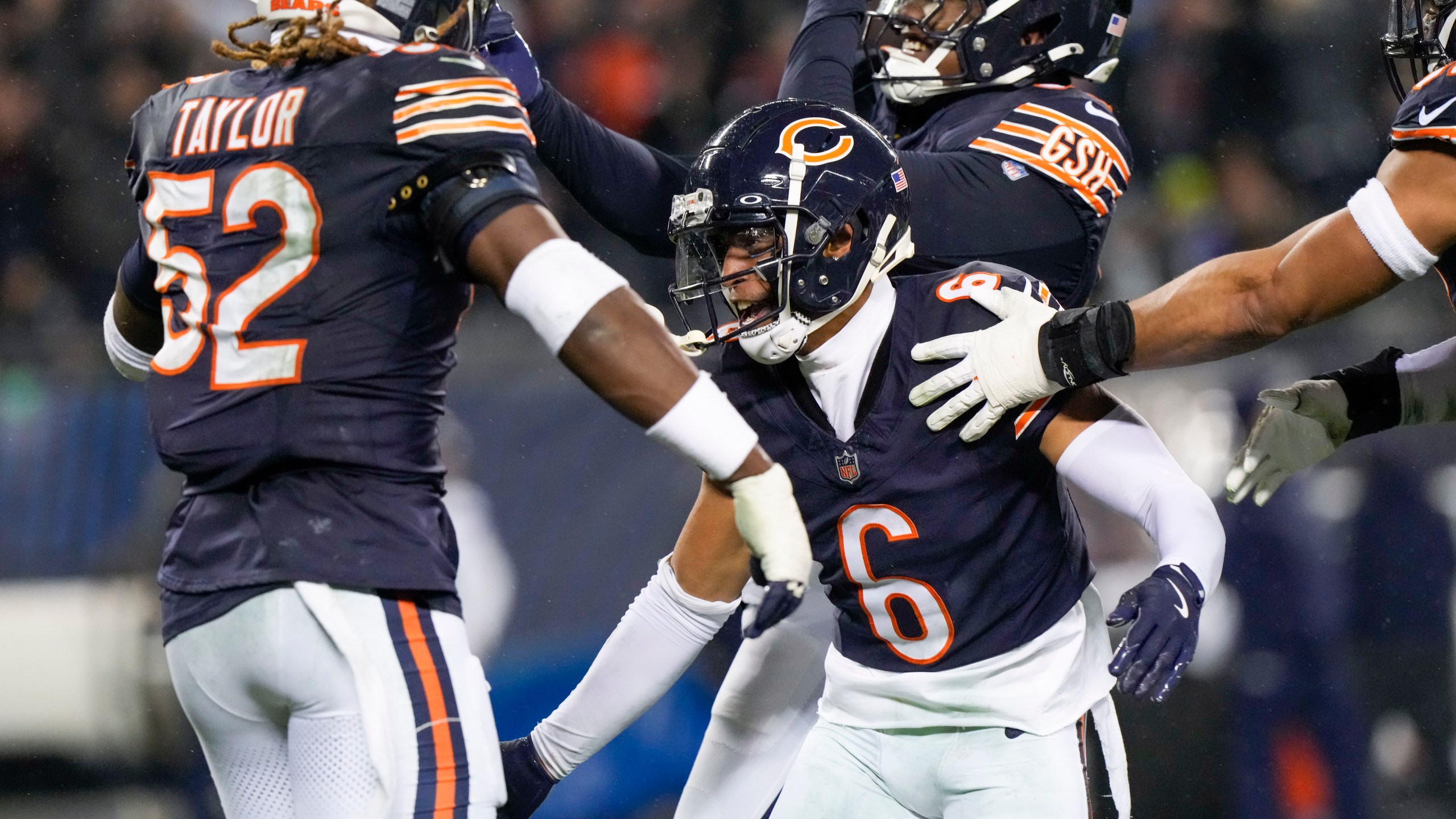 Chicago Bears cornerback Kyler Gordon (6) celebrates his fumble recovery with teammates during the second half of an NFL football game against the Seattle Seahawks, Thursday, Dec. 26, 2024, in Chicago. (AP Photo/Nam Y. Huh)