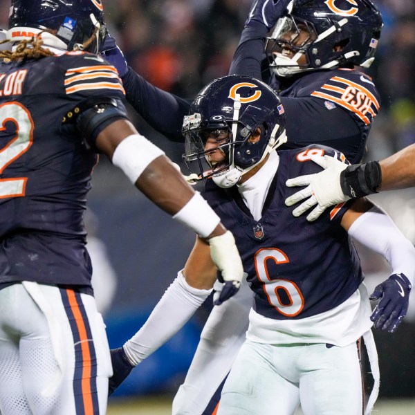 Chicago Bears cornerback Kyler Gordon (6) celebrates his fumble recovery with teammates during the second half of an NFL football game against the Seattle Seahawks, Thursday, Dec. 26, 2024, in Chicago. (AP Photo/Nam Y. Huh)