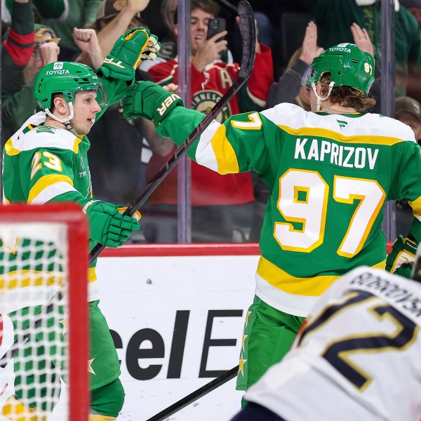 Minnesota Wild center Marco Rossi, left, celebrates his power-play goal with left wing Kirill Kaprizov (97) during the first period of an NHL hockey game against the Florida Panthers Wednesday, Dec. 18, 2024, in St. Paul, Minn. (AP Photo/Matt Krohn)