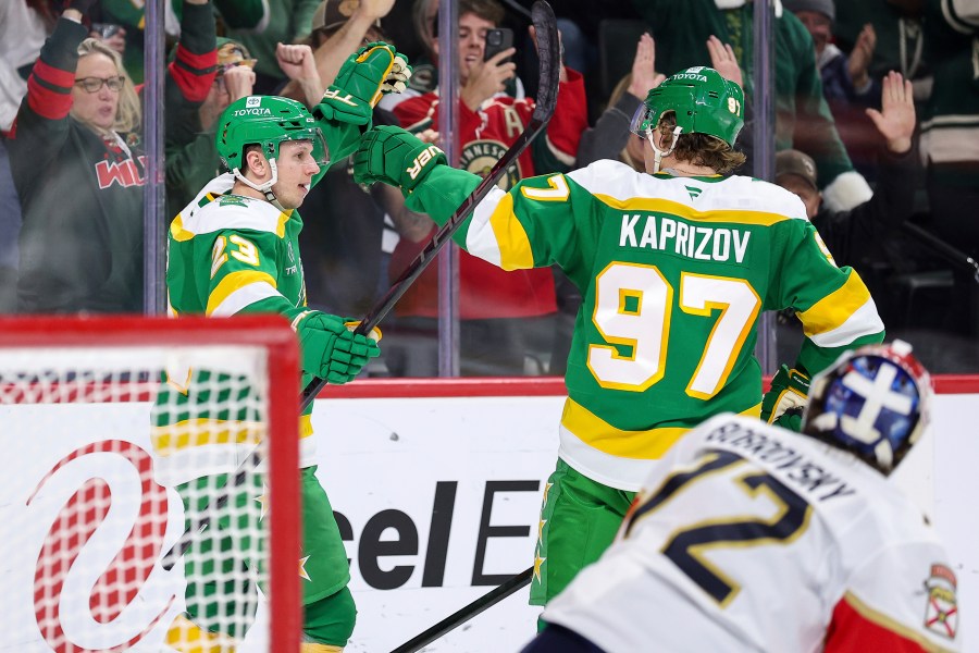 Minnesota Wild center Marco Rossi, left, celebrates his power-play goal with left wing Kirill Kaprizov (97) during the first period of an NHL hockey game against the Florida Panthers Wednesday, Dec. 18, 2024, in St. Paul, Minn. (AP Photo/Matt Krohn)