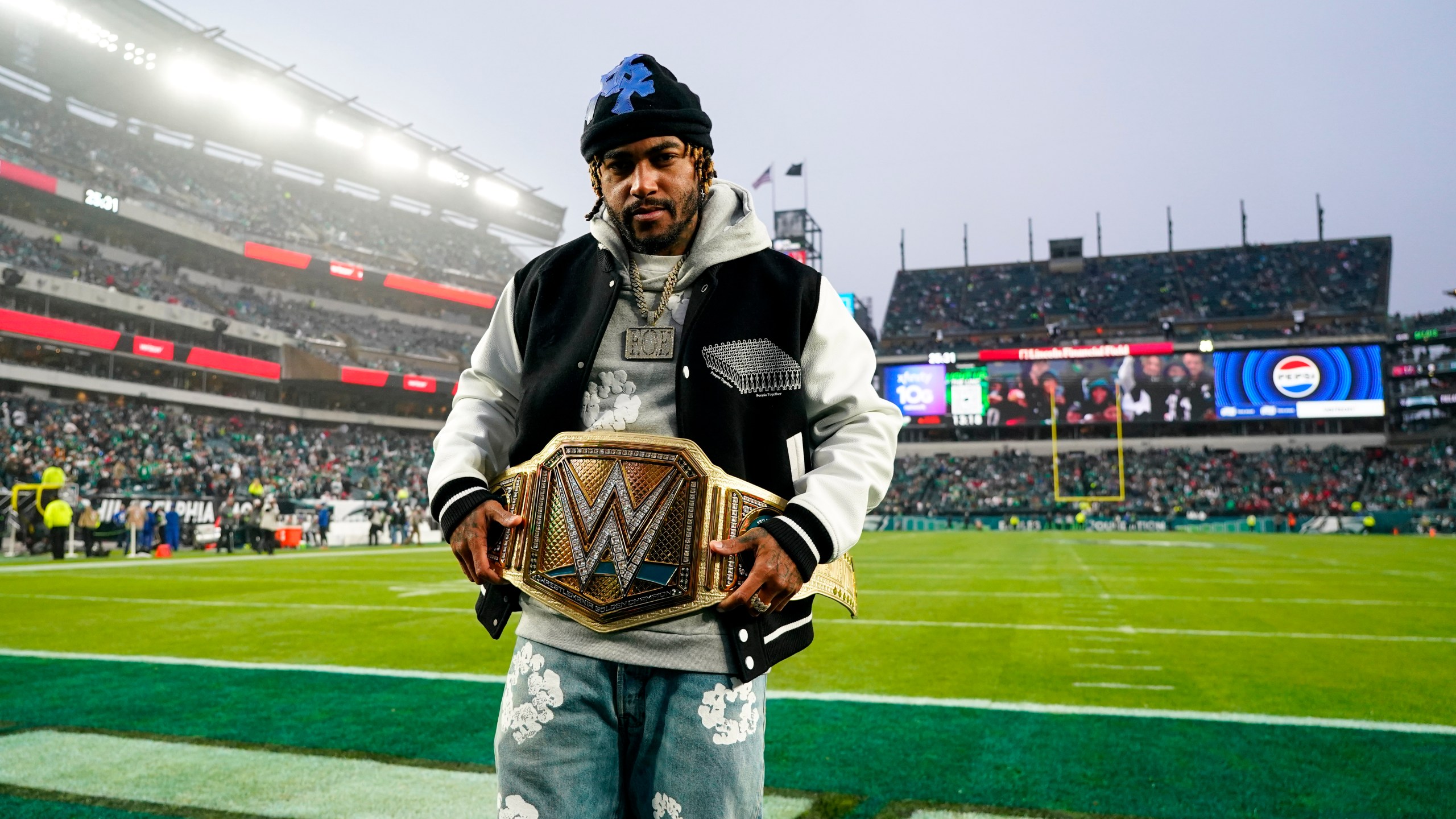 FILE -Former Philadelphia Eagles wide receiver DeSean Jackson poses with the WWE belt prior to an NFL football game between the Eagles and the San Francisco 49ers, Sunday, Dec. 3, 2023, in Philadelphia. (AP Photo/Chris Szagola, File)