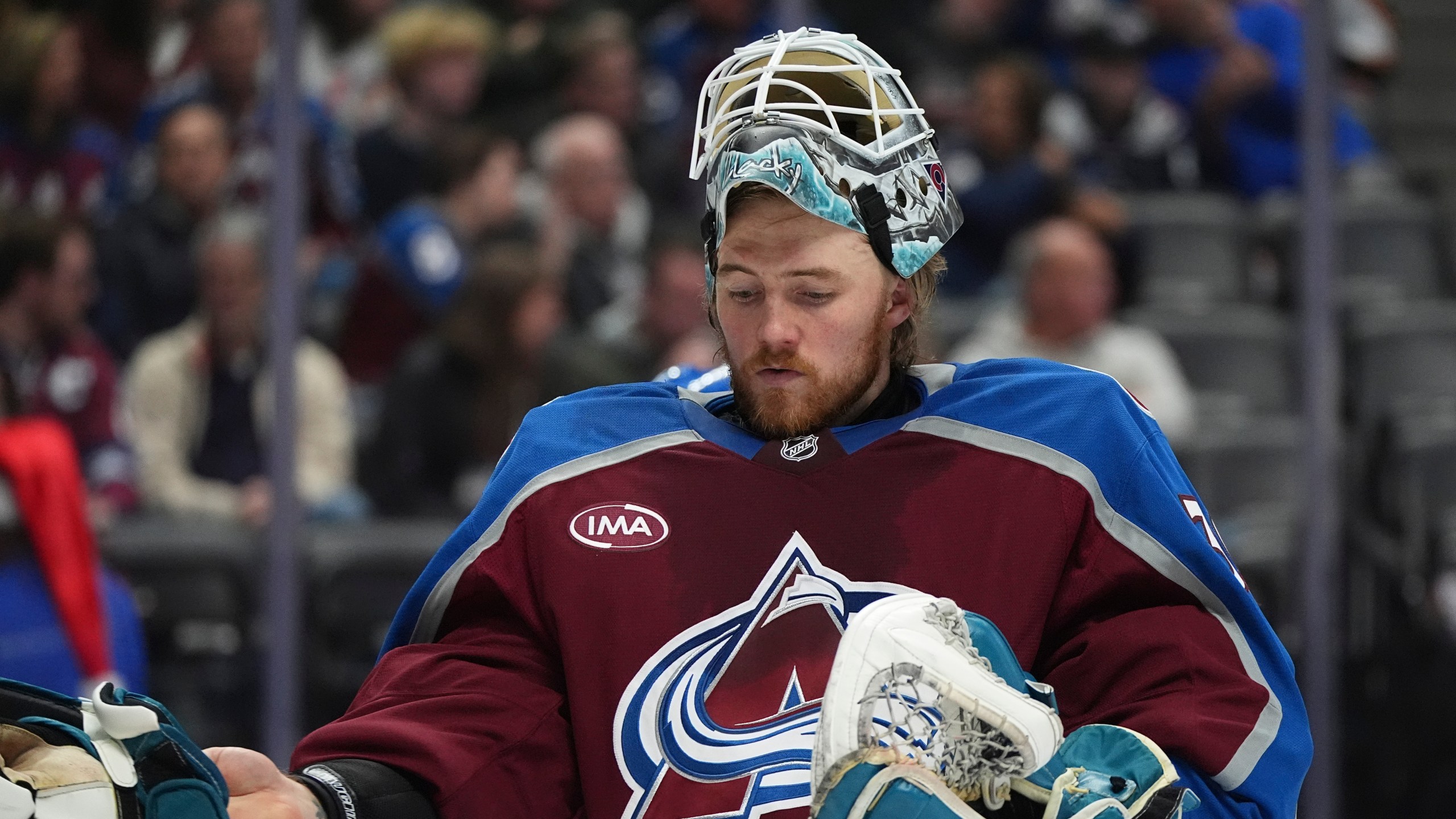 Colorado Avalanche goaltender Mackenzie Blackwood prepares for the second period of an NHL hockey game against the Seattle Kraken, Sunday, Dec. 22, 2024, in Denver. (AP Photo/David Zalubowski)