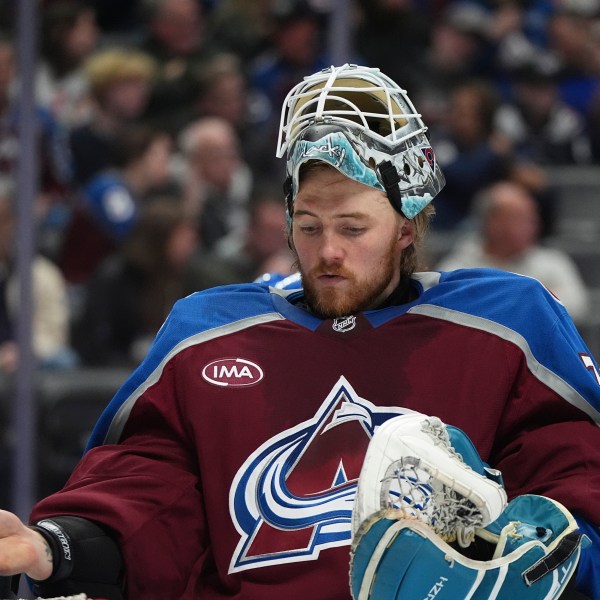 Colorado Avalanche goaltender Mackenzie Blackwood prepares for the second period of an NHL hockey game against the Seattle Kraken, Sunday, Dec. 22, 2024, in Denver. (AP Photo/David Zalubowski)