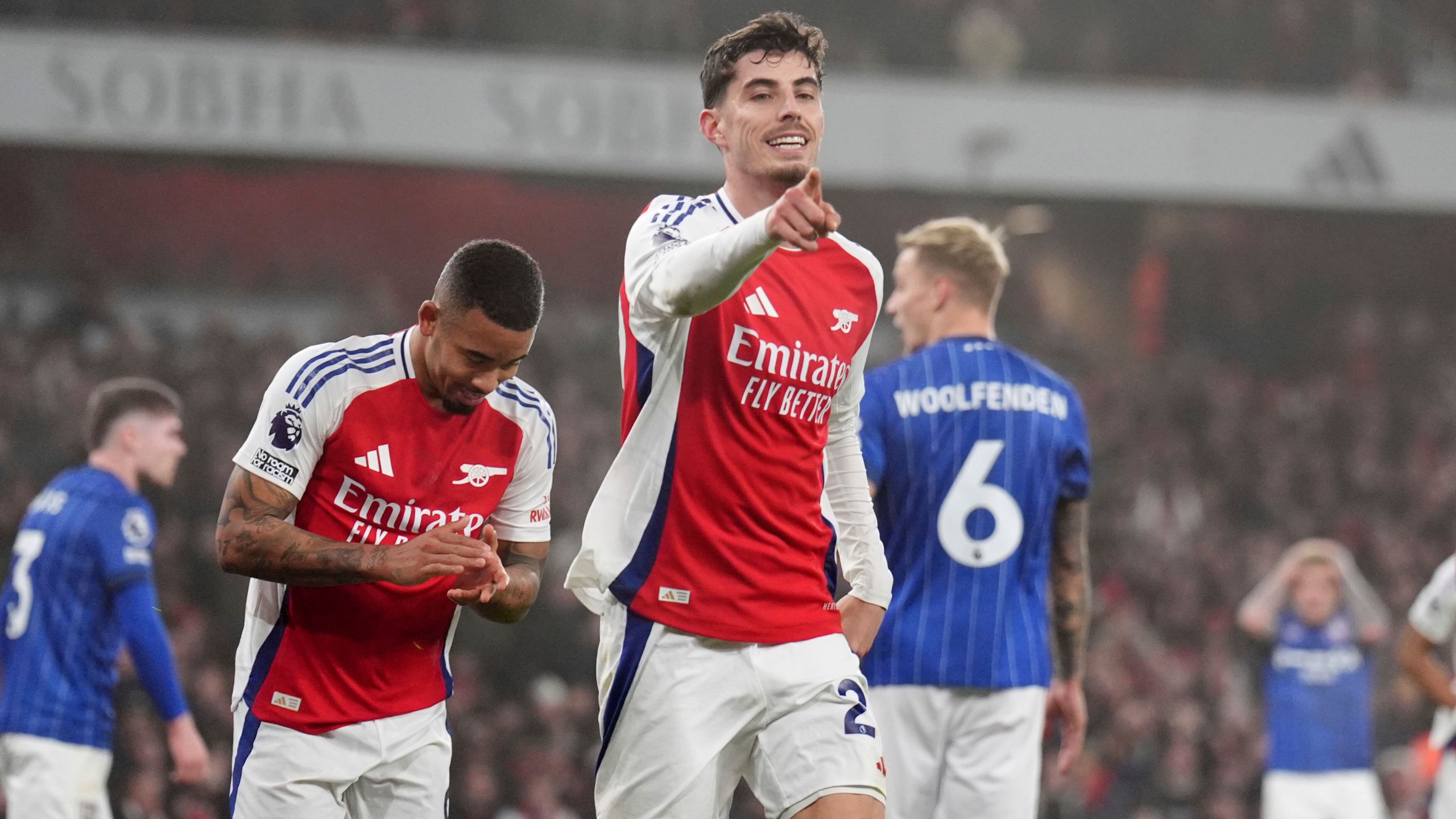 Arsenal's Kai Havertz, center, celebrates after scoring the opening goal during the English Premier League soccer match between Arsenal and Ipswich at the Emirates Stadium in London, England, Friday, Dec. 27, 2024. (John Walton/PA via AP)