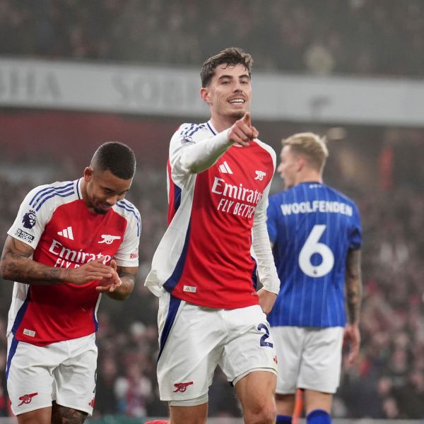 Arsenal's Kai Havertz, center, celebrates after scoring the opening goal during the English Premier League soccer match between Arsenal and Ipswich at the Emirates Stadium in London, England, Friday, Dec. 27, 2024. (John Walton/PA via AP)