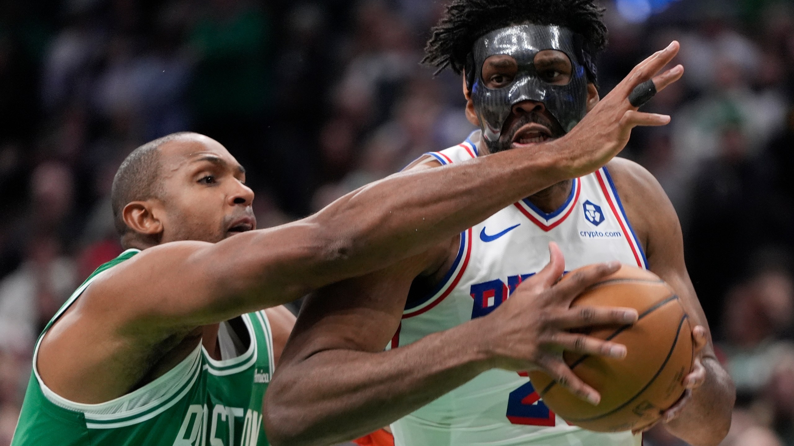 Philadelphia 76ers' Joel Embiid drives past Boston Celtics' Al Horford during the second half of an NBA basketball game, Wednesday, Dec. 25, 2024, in Boston (AP Photo/Michael Dwyer)