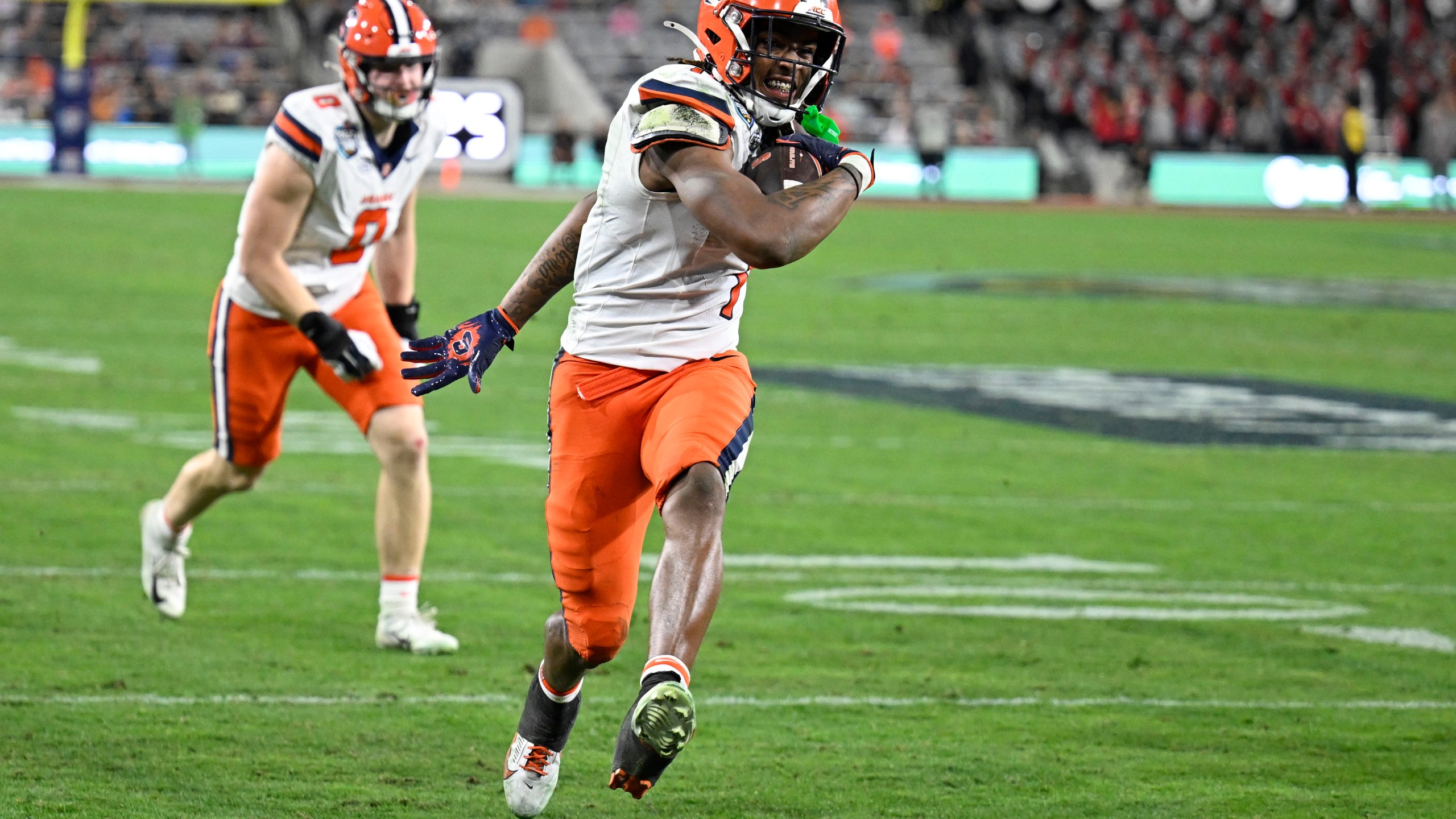 Syracuse running back LeQuint Allen (1) scores on a two-point conversion during the first half of the Holiday Bowl NCAA college football game against Washington State Friday, Dec. 27, 2024, in San Diego. (AP Photo/Denis Poroy)