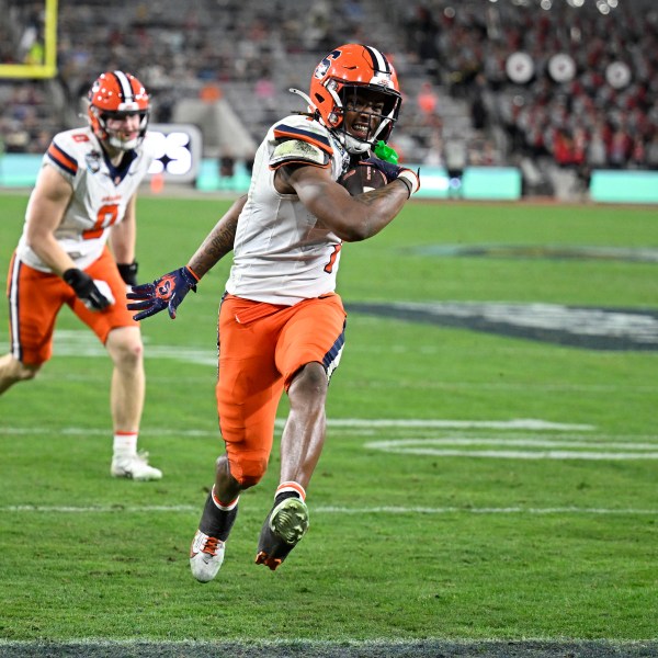 Syracuse running back LeQuint Allen (1) scores on a two-point conversion during the first half of the Holiday Bowl NCAA college football game against Washington State Friday, Dec. 27, 2024, in San Diego. (AP Photo/Denis Poroy)