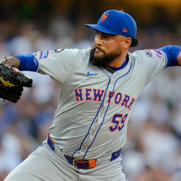 FILE - New York Mets pitcher Sean Manaea throws against the Los Angeles Dodgers during the first inning in Game 6 of a baseball NL Championship Series, Sunday, Oct. 20, 2024, in Los Angeles. (AP Photo/Julio Cortez, File)