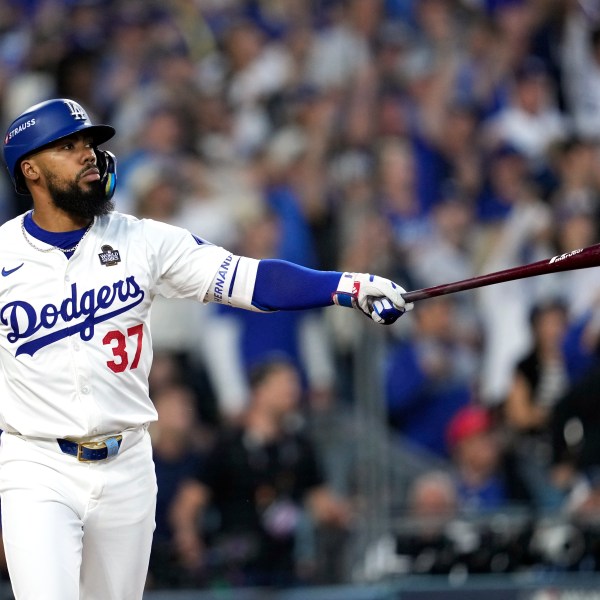 FILE - Los Angeles Dodgers' Teoscar Hernández watches his two-run home run against the New York Yankees during the third inning in Game 2 of the baseball World Series, Saturday, Oct. 26, 2024, in Los Angeles. (AP Photo/Godofredo A. Vásquez, File)