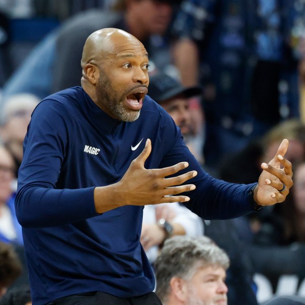 Orlando Magic head coach Jamahl Mosley reacts as his team plays the Miami Heat during the second half of an NBA basketball game, Thursday, Dec. 26, 2024, in Orlando, Fla. (AP Photo/Kevin Kolczynski)