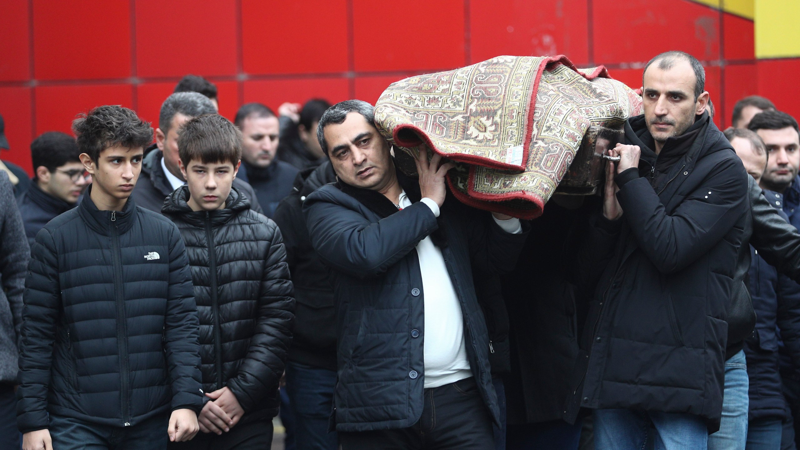 People attend a funeral of Mahammadali Eganov who died in the Azerbaijan Airlines Embraer 190 crash near the Kazakhstan's airport of Aktau at the age of 13, in Baku, Azerbaijan, Saturday, Dec. 28, 2024. (AP Photo)