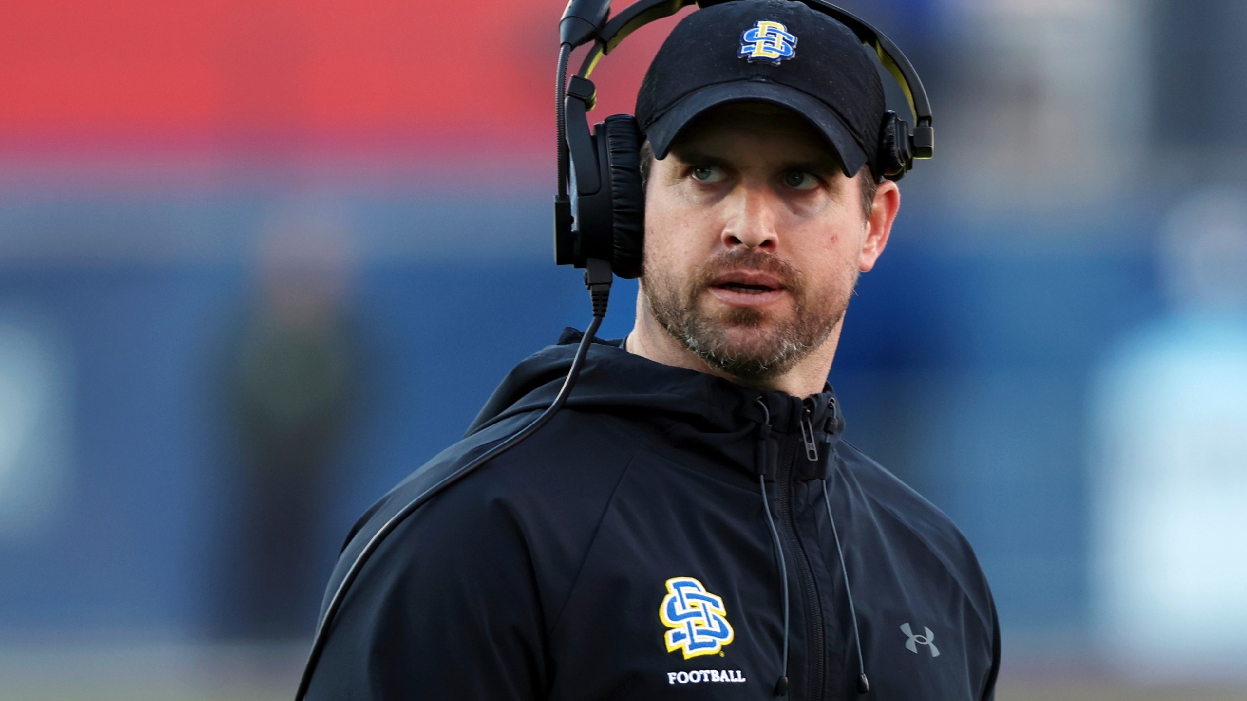 FILE - South Dakota State head coach Jimmy Rogers stands on the field at the FCS Championship NCAA college football game against Montana, Sunday, Jan. 7, 2024, in Frisco, Texas. (AP Photo/Richard W. Rodriguez, File)