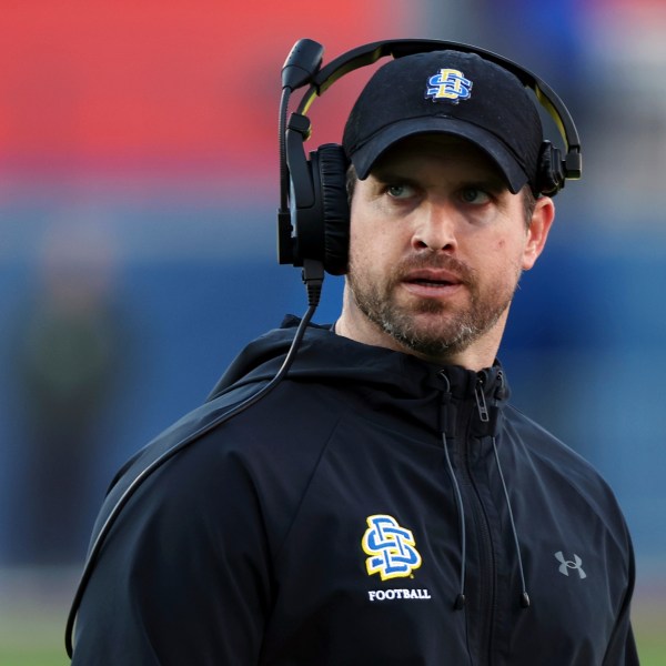 FILE - South Dakota State head coach Jimmy Rogers stands on the field at the FCS Championship NCAA college football game against Montana, Sunday, Jan. 7, 2024, in Frisco, Texas. (AP Photo/Richard W. Rodriguez, File)