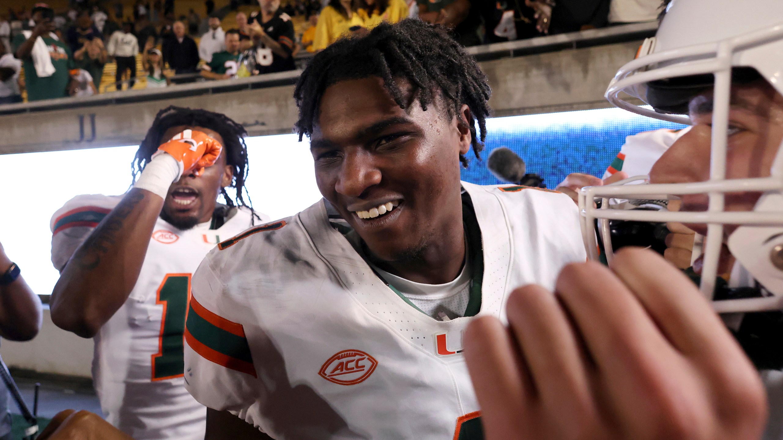 Miami quarterback Cam Ward (1) celebrates after defeating California during an NCAA college football game in Berkeley, Calif., Saturday, Oct. 5, 2024. (AP Photo/Jed Jacobsohn)