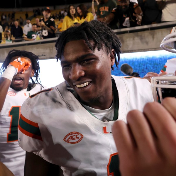 Miami quarterback Cam Ward (1) celebrates after defeating California during an NCAA college football game in Berkeley, Calif., Saturday, Oct. 5, 2024. (AP Photo/Jed Jacobsohn)