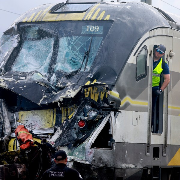 A damaged Brightline train is seen after it collided with a fire truck in downtown Delray Beach, Fla., Saturday, Dec. 28, 2024. (Mike Stocker/South Florida Sun-Sentinel via AP)