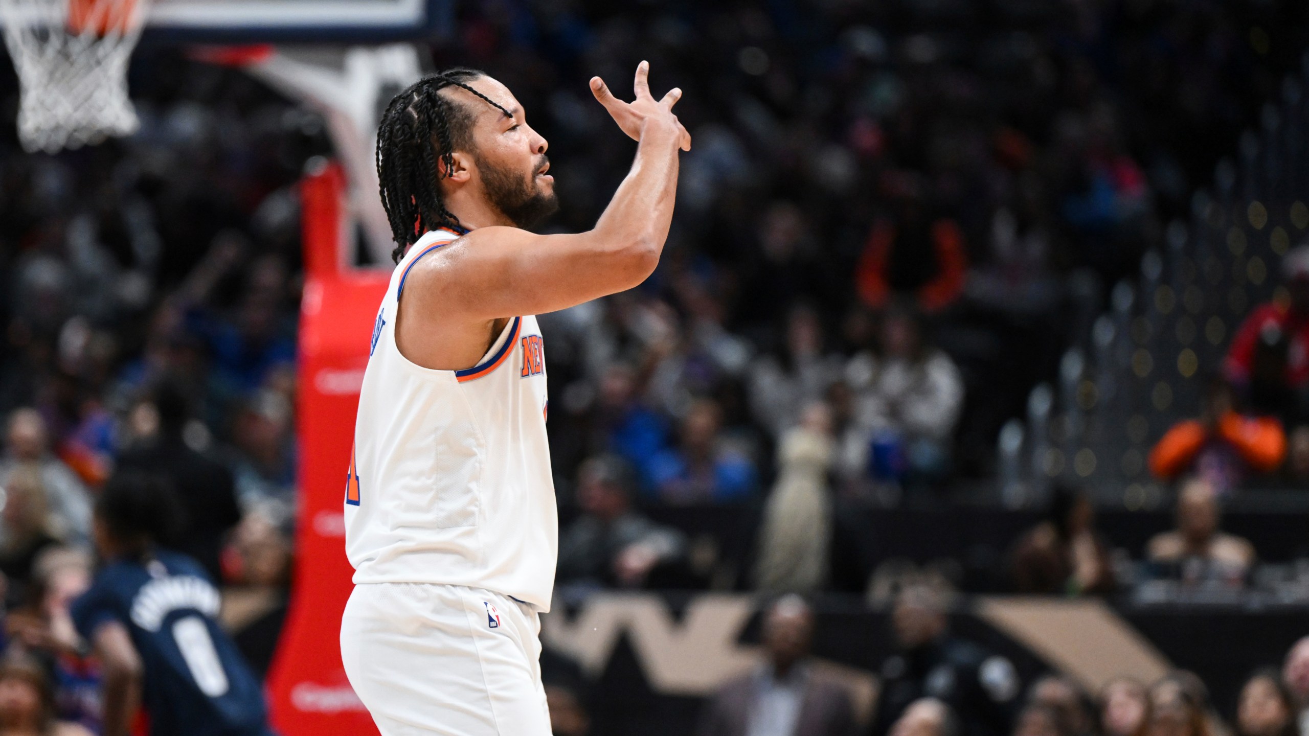 New York Knicks guard Jalen Brunson gestures after making a three-point basket during the first half of an NBA basketball game against the Washington Wizards, Saturday, Dec. 28, 2024, in Washington. (AP Photo/Terrance Williams)