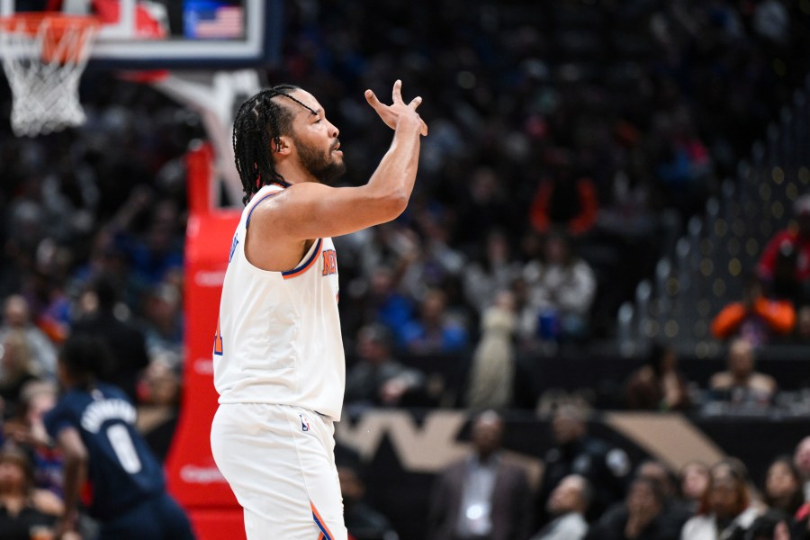 New York Knicks guard Jalen Brunson gestures after making a three-point basket during the first half of an NBA basketball game against the Washington Wizards, Saturday, Dec. 28, 2024, in Washington. (AP Photo/Terrance Williams)