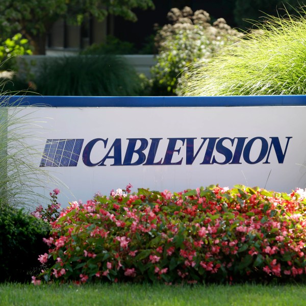 FILE - A sign is displayed at Cablevision headquarters in Bethpage, N.Y., on Sept. 17, 2015. (AP Photo/Seth Wenig, File)