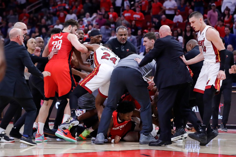 Both bench clear for a brawl after Houston Rockets forward Amen Thompson threw Miami Heat guard Tyler Herro to the court, resulting in multiple ejections for both teams in the final minute of play during the second half of an NBA basketball game Sunday, Dec. 29, 2024, in Houston. (AP Photo/Michael Wyke)