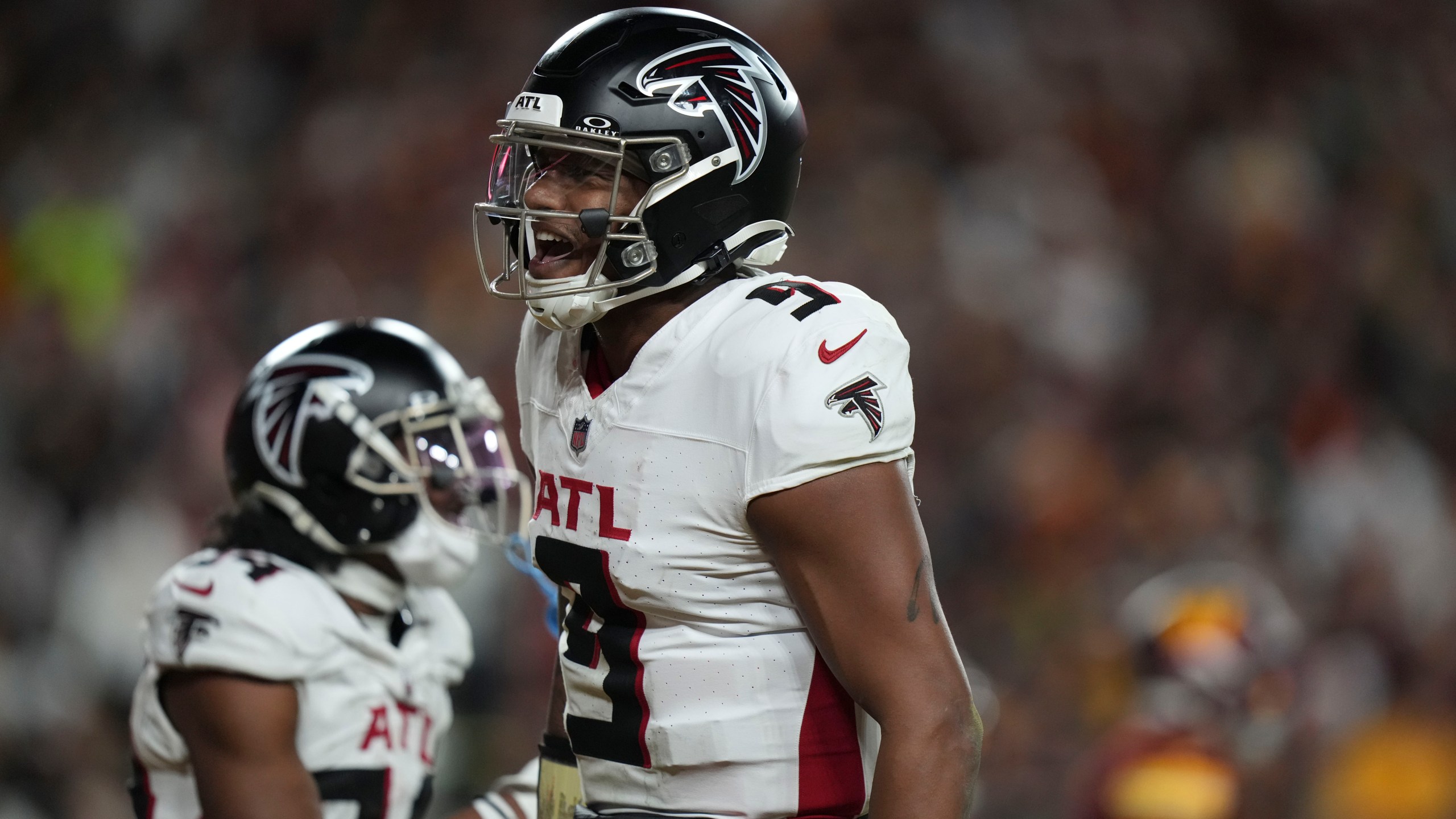 Atlanta Falcons quarterback Michael Penix Jr. (9) celebrates a touchdown during the second half of an NFL football game against the Washington Commanders, Sunday, Dec. 29, 2024, in Landover, Md. (AP Photo/Stephanie Scarbrough)