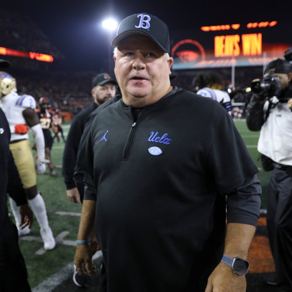 FILE - UCLA coach Chip Kelly walks off the field following the team's NCAA college football game against Oregon State, Oct. 14, 2023, in Corvallis, Ore. (AP Photo/Amanda Loman, File)