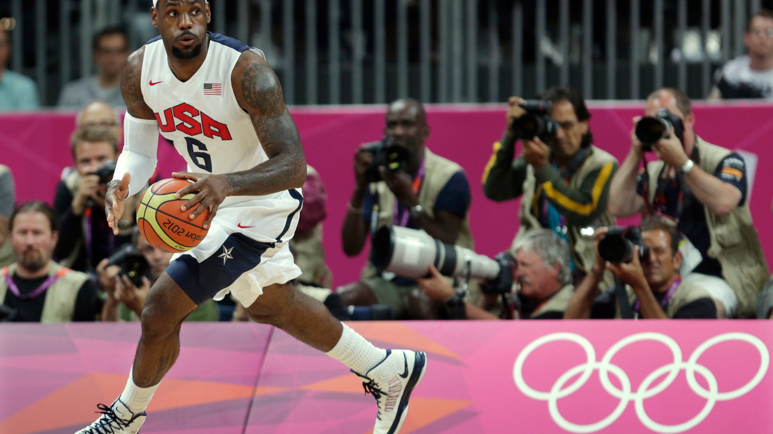 FILE - United States' Lebron James looks up the court during the first half of a preliminary men's basketball game against France at the 2012 Summer Olympics, on July 29, 2012, in London. (AP Photo/Charles Krupa, File)