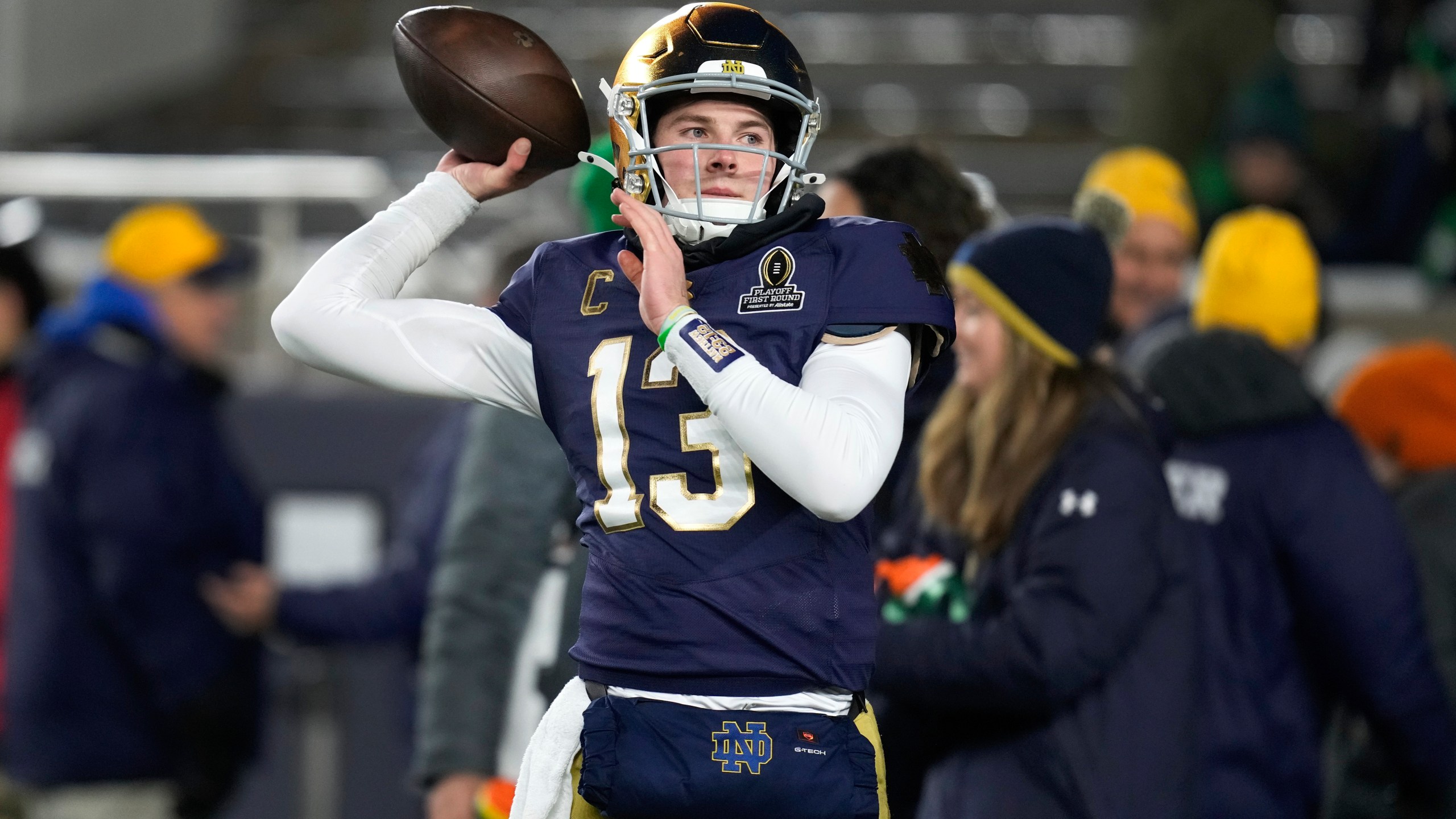 Notre Dame quarterback Riley Leonard (13) throws before the first half in the first round of the College Football Playoff against Indiana, Friday, Dec. 20, 2024, in South Bend, Ind. (AP Photo/Darron Cummings)