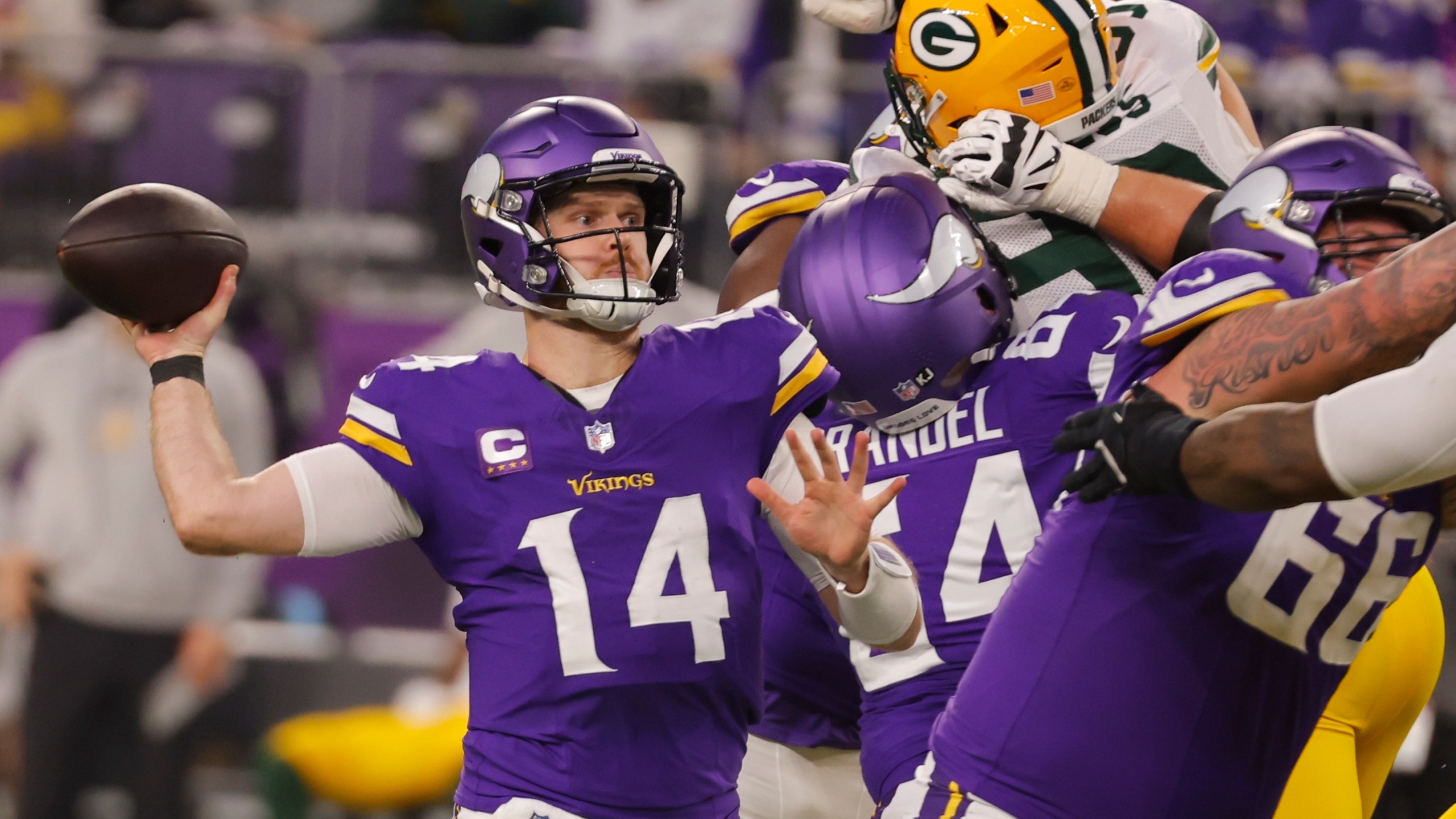 Minnesota Vikings' Sam Darnold throws during the first half of an NFL football game against the Green Bay Packers Sunday, Dec. 29, 2024, in Minneapolis. (AP Photo/Bruce Kluckhohn)