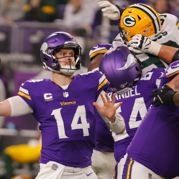 Minnesota Vikings' Sam Darnold throws during the first half of an NFL football game against the Green Bay Packers Sunday, Dec. 29, 2024, in Minneapolis. (AP Photo/Bruce Kluckhohn)