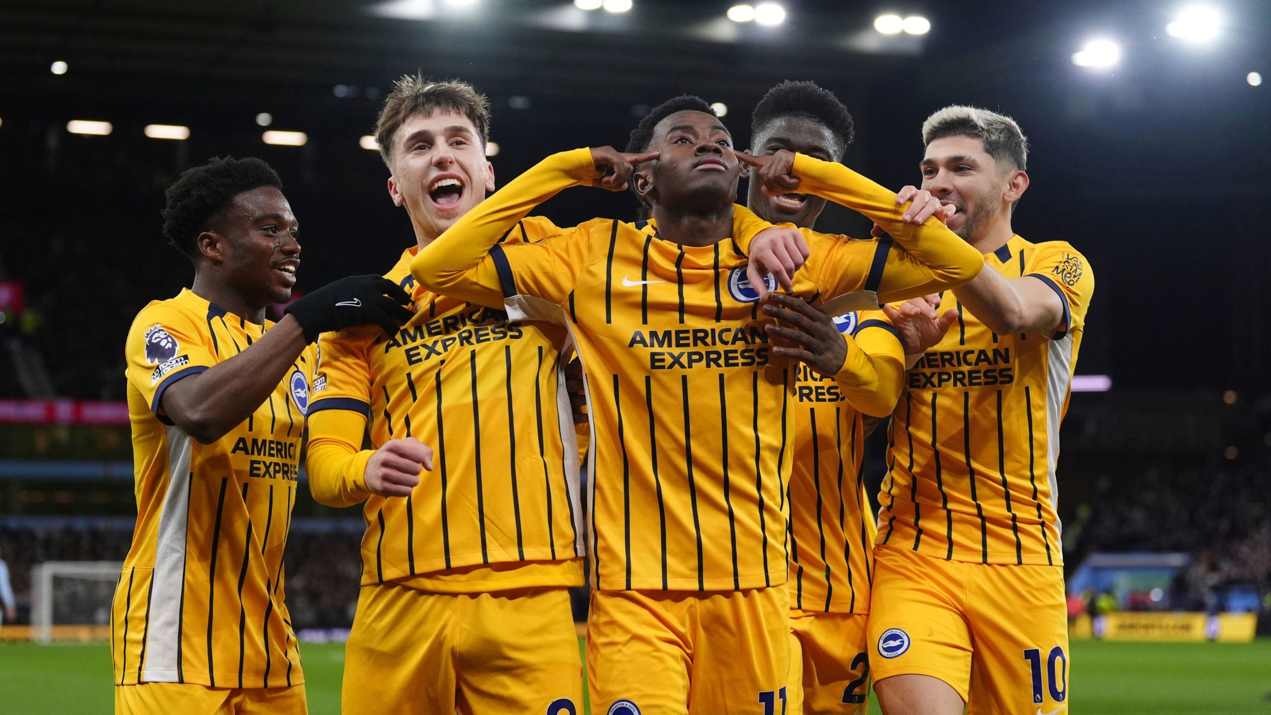 Brighton and Hove Albion's Simon Adingra celebrates scoring with teammates during the English Premier League soccer match between Aston Villa and Brighton and Hove Albion at Villa Park, Birmingham, England, Monday Dec. 30, 2024. (Bradley Collyer/PA via AP)