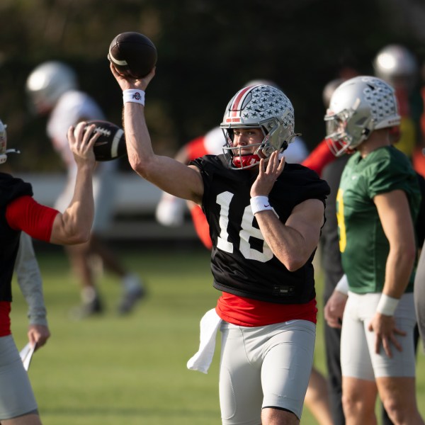 Ohio State quarterback Will Howard (18) throws during practice in Carson, Calif., Monday, Dec. 30, 2024, ahead of Wednesday's Rose Bowl College Football Playoff against Oregon. (AP Photo/Kyusung Gong)