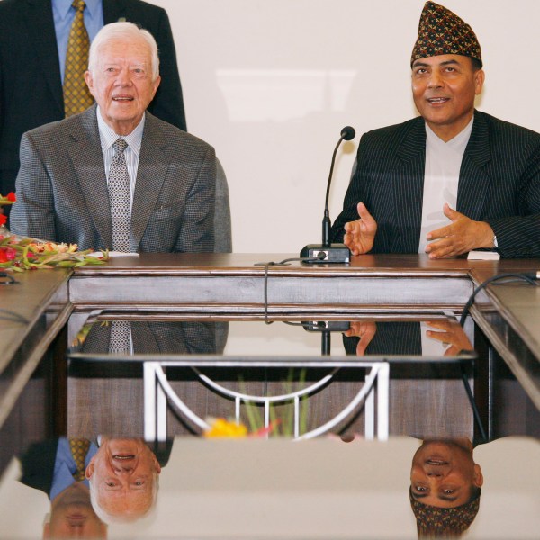 FILE - Former U.S. President Jimmy Carter meets with Bhoj Raj Pokhrel, Nepal's chief election official, on April 8, 2008, in Katmandu, Nepal. (AP Photo/Ed Wray, File)