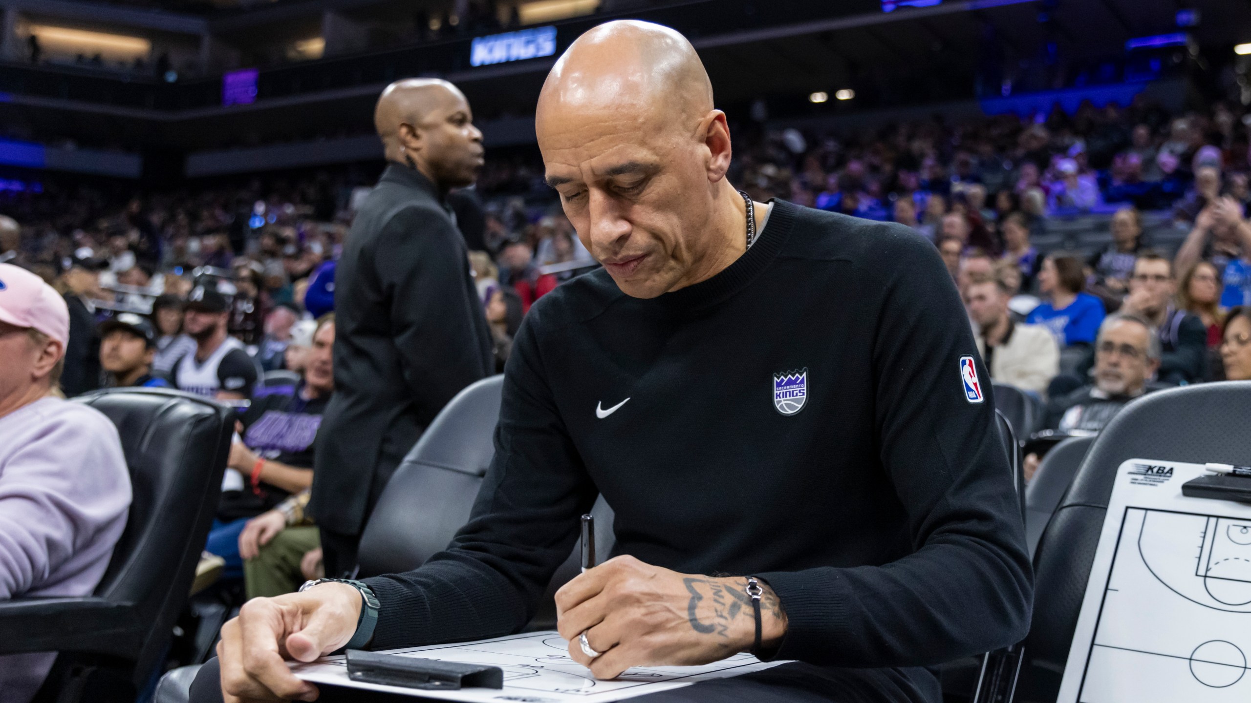 Sacramento Kings Interim Head Coach Doug Christie draws out a play before an NBA basketball game against the Dallas Mavericks Monday, Dec. 30, 2024, in Sacramento, Calif. (AP Photo/Sara Nevis)